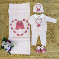 Coordinato neonata rosa in pura lana con fiocchi ciclamino.