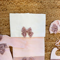 copertina neonata in ciniglia rosa con fiocco decorato a mano