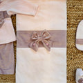 copertina neonata in ciniglia rosa con fiocco decorato a mano