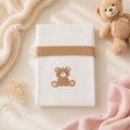 Tutina neonata rosa e grigio con fiocco, colletto bianco e finiture ai polsini per corredino nascita.