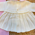 Uscita clinica neonata in pura lana con copertina latte e rosa confetto Made in Italy.