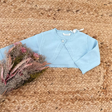 Coprispalle neonata azzurro in cotone con fiore decorativo frontale