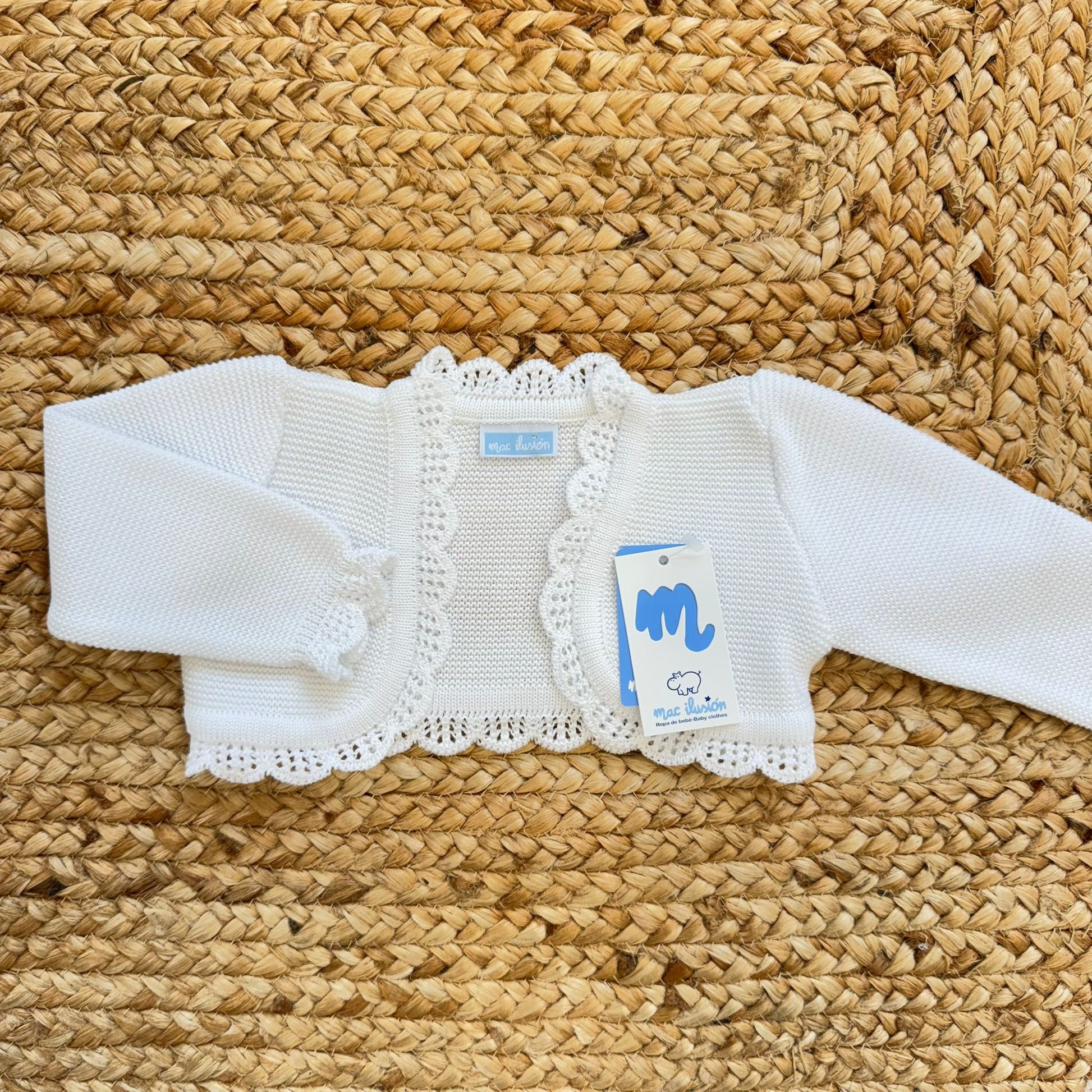 coprispalle neonata bianco in maglia con bordo traforato