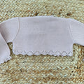 Coprispalle neonata rosa vista posteriore con bordo ondulato