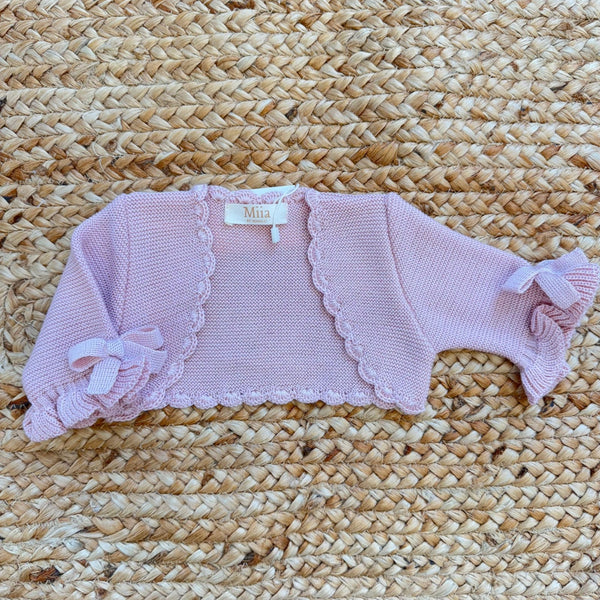 coprispalle neonata rosa con fiocchi sulle maniche