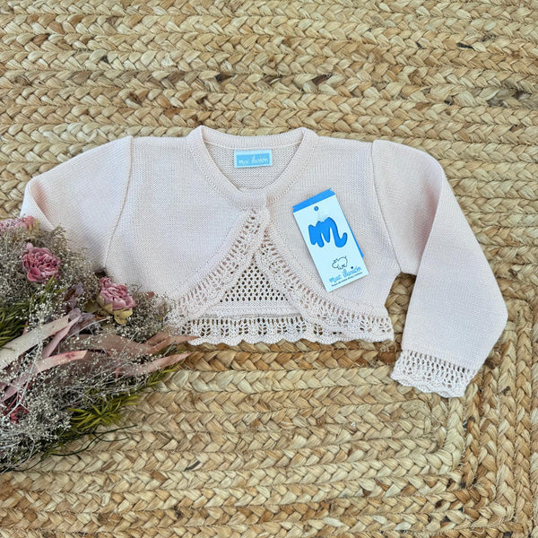 Coprispalle neonata rosa cipria con lavorazione traforata frontale