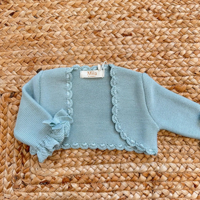 coprispalle neonata verde acqua con fiocchi sulle maniche