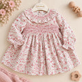 Abito bimba in cotone floreale rosa con lavorazione smock e colletto volant