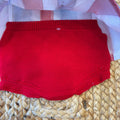 dettaglio culotte maglia rossa neonata
