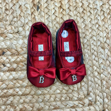 Scarpine culla bimba raso rosso con fiocco e charm