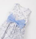 dettaglio abito bimba fiocco azzurro e fantasia farfalle