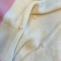 Uscita clinica neonata in pura lana con copertina latte e rosa confetto Made in Italy.