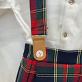 Completo salopette natalizio bimbo Calamaro Baby con camicia bianca e pantaloncini tartan rossi, verdi e blu con bretelle