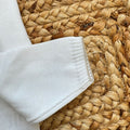 dettaglio cardigan cotone bianco bimbo elegante
