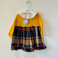 Abitino bimba senape con gonna scozzese tartan e colletto bianco ricamato.