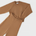 Completo bambina in maglia color biscotto con maglia girocollo a trecce e pantaloni a palazzo coordinati
