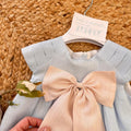 Abito celeste bimba in lino con manichine strutturate