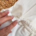 Pagliaccetto battesimo bimbo bianco in cotone e lino con colletto sartoriale