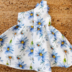 Vestito bambina con fiori azzurri e grande fiore decorativo sulla spalla