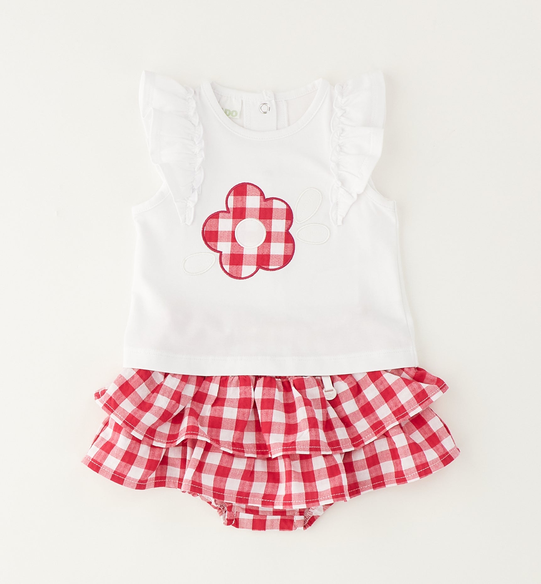 Dettaglio maglia bimba con applicazione fiore vichy