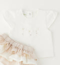 Dettaglio maglia bimba con ricamo floreale elegante