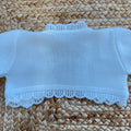 dettaglio lavorazione maglia coprispalle battesimo