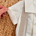Dettaglio pantaloncino corto beige dalla linea classica e raffinata