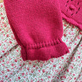 Abito bimba rosso bordeaux floreale con parte superiore in maglia e gonna fantasia