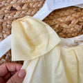 dettaglio spalla abito bimba giallo chantilly elegante