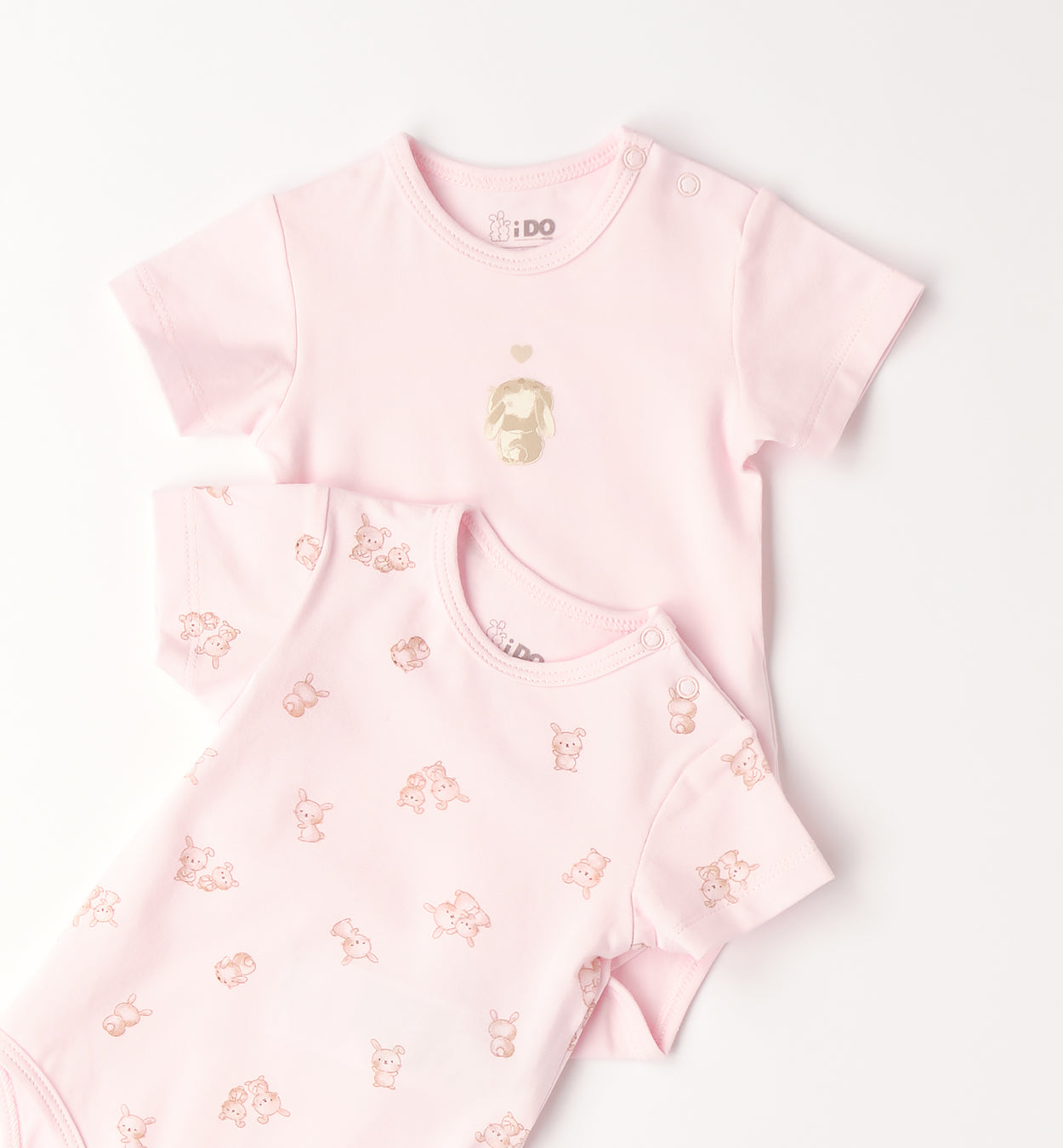 dettaglio stampa cucciolo body neonata rosa