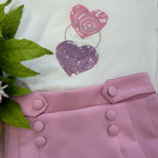 dettaglio cuori glitterati su t-shirt bambina