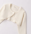 dettaglio cardigan panna bimba con chiusura a fiore