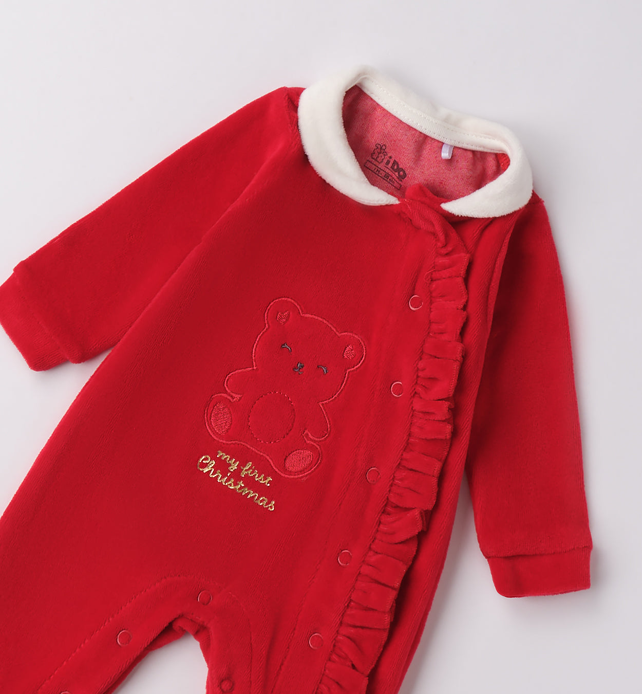 dettaglio colletto bianco e orsetto ricamato tutina unisex Natale
