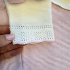 dettaglio pantalone bianco in lana traforata neonata
