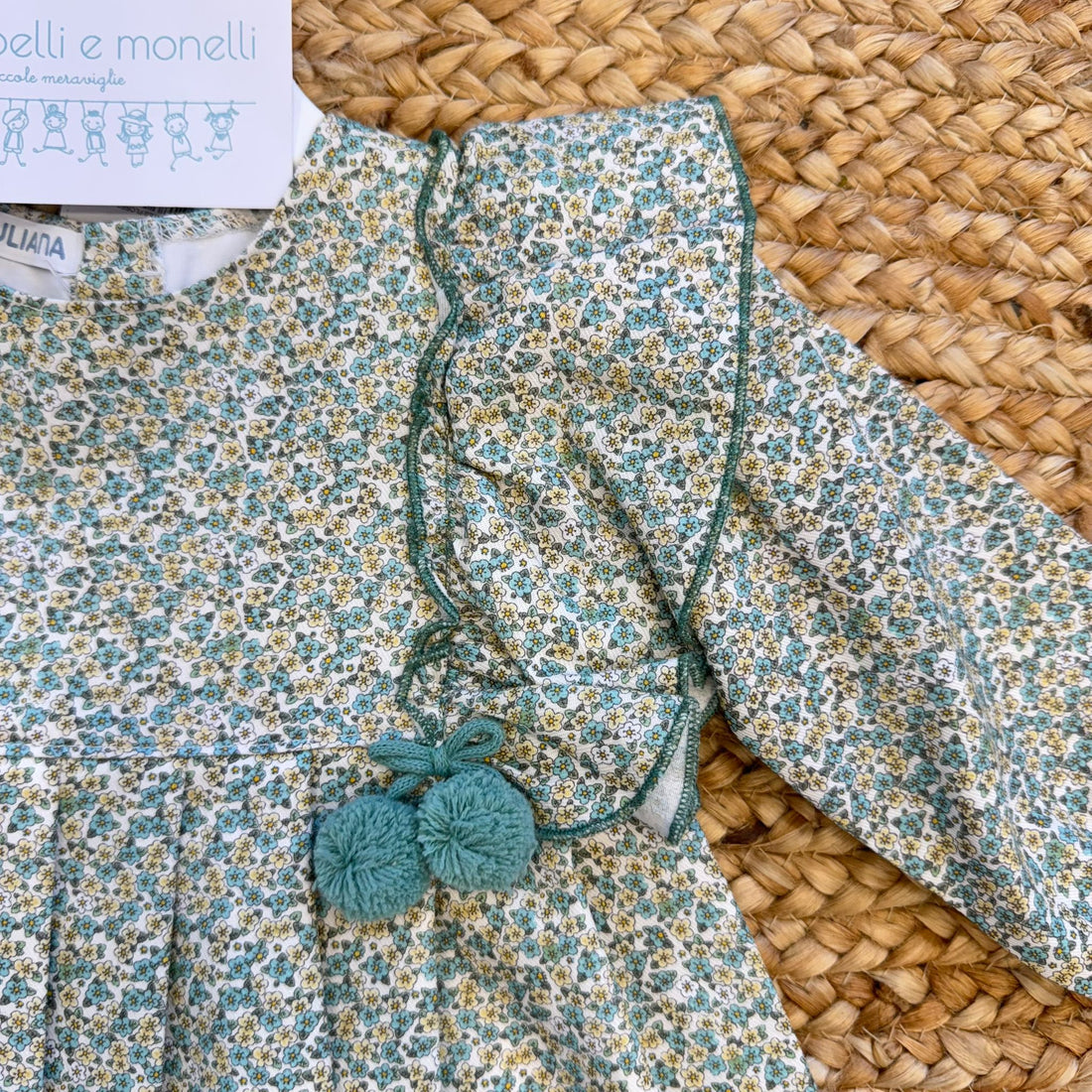 abito elegante bimba floreale verde con volant e pon pon