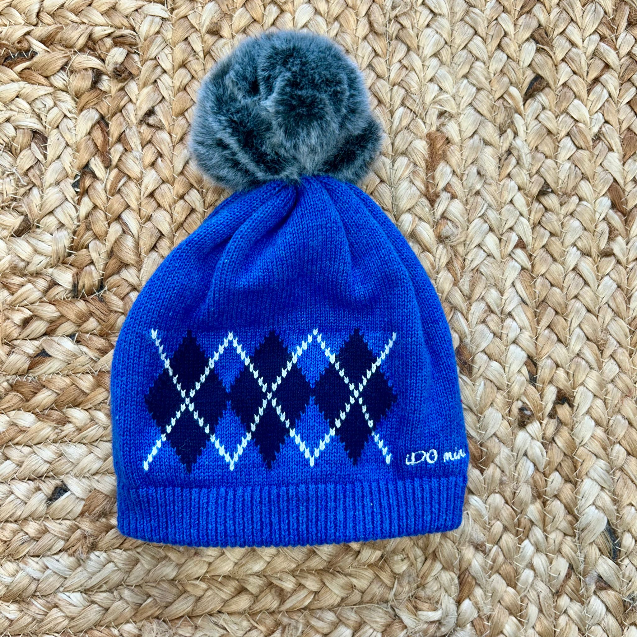 Cappellino blu bimbo con pon pon