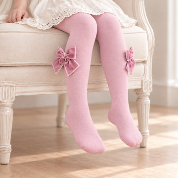 Collant bimba rosa antico con fiocchi laterali in velluto