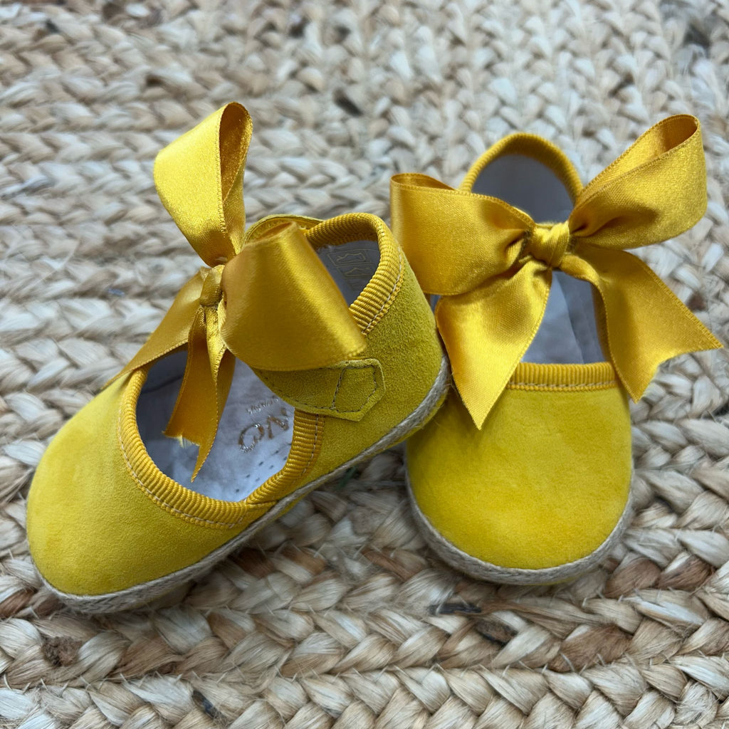Espadrillas neonata con fiocco laterale giallo