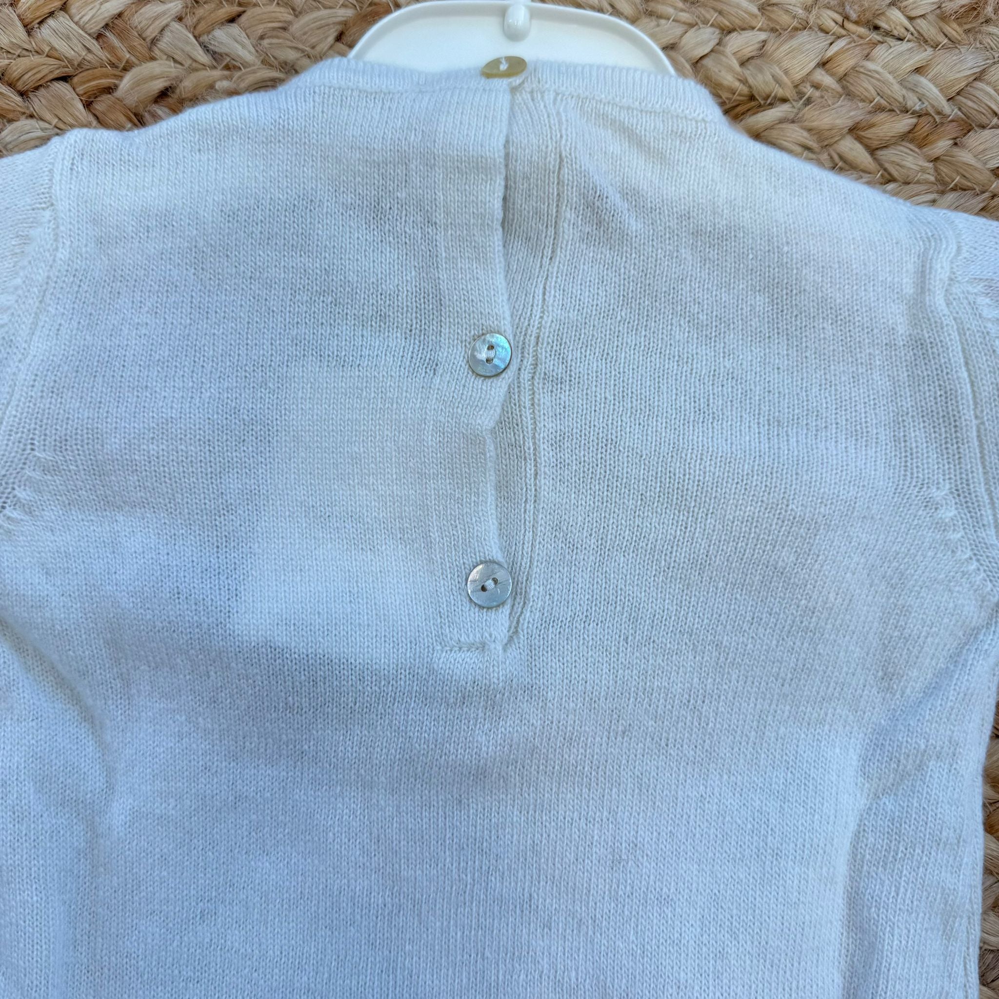 Tutina neonata in lana e cashmere panna con fiocchi rosa
