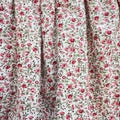 Abito bimba rosso bordeaux floreale con parte superiore in maglia e gonna fantasia