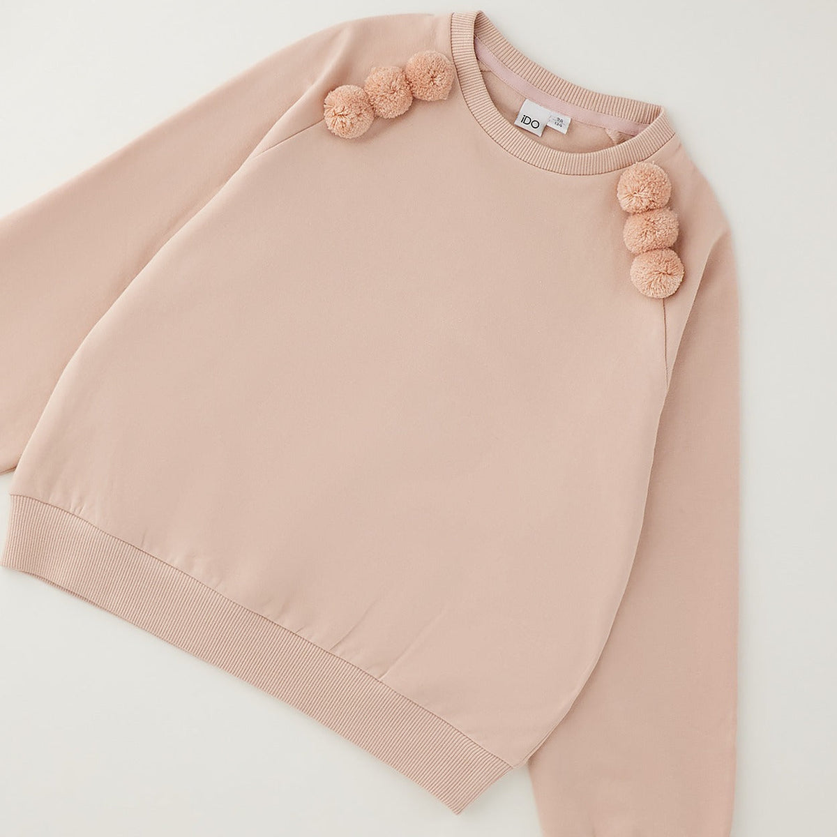 Felpa bimba rosa in caldo cotone con pompon sulle spalle