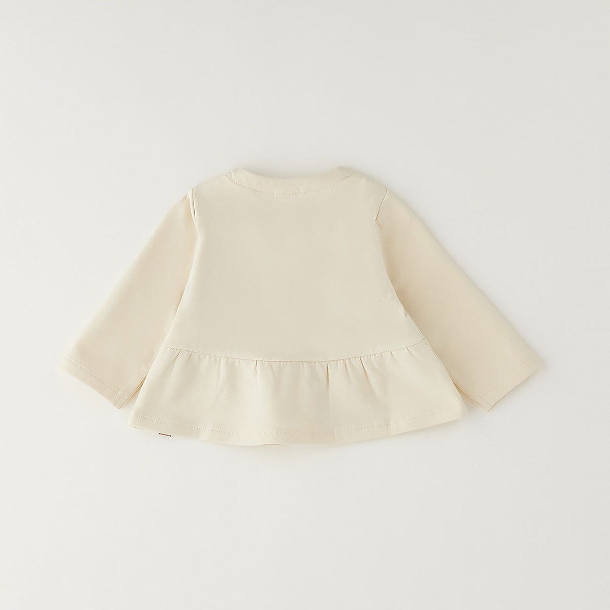 Giacca bimba in caldo cotone color panna con balza e chiusura frontale
