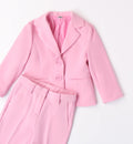 Blazer bambina rosa confetto con bottoni tono su tono e fiori decorativi.