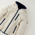 Giubbotto reversibile bimbo beige con cappuccio e dettagli blu