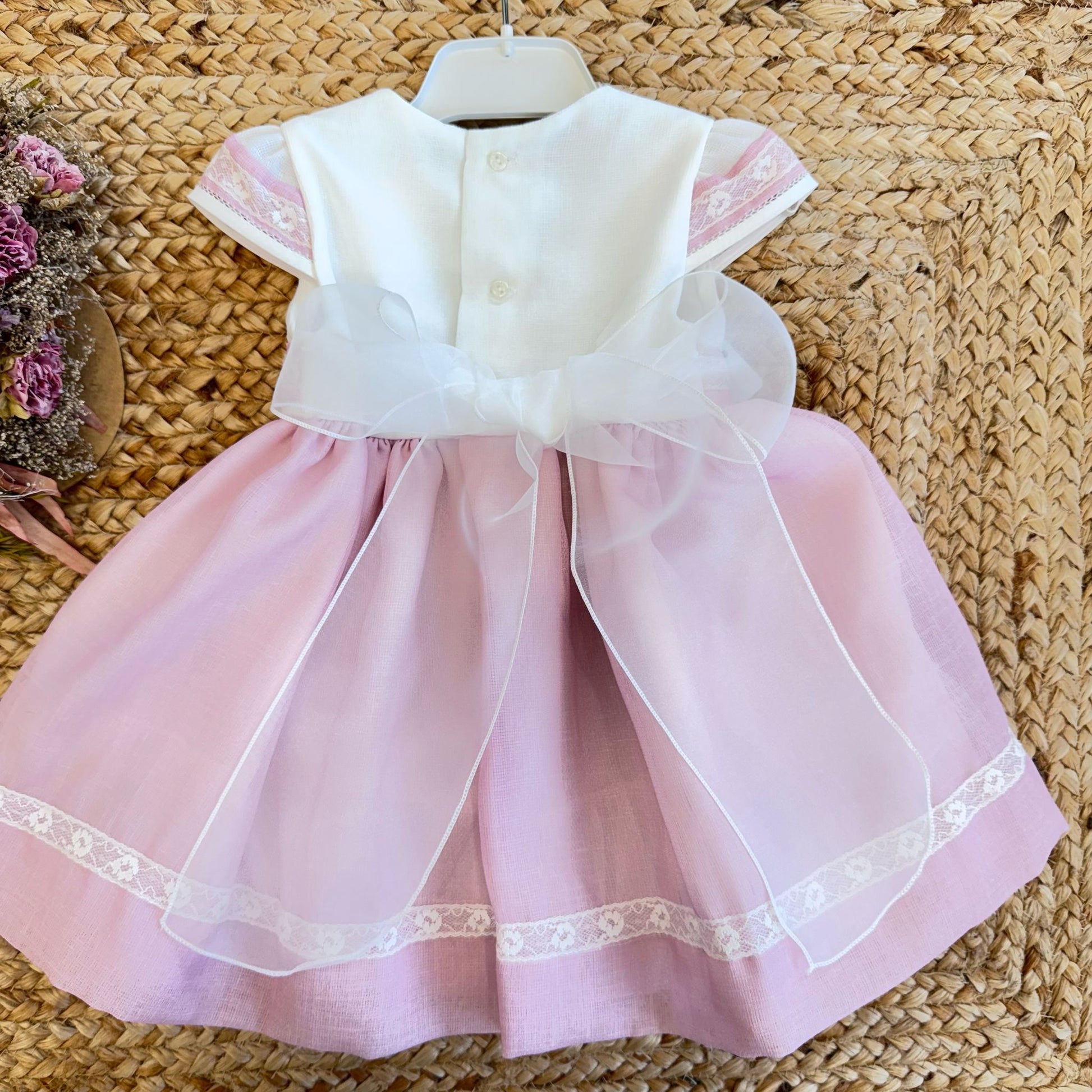 Orlo gonna rosa con nastro floreale ricamato