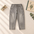 Jeans bimbo grigio con cuciture sagomate sulle gambe vista frontale