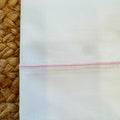 Set lenzuola neonata in cotone bianco con profilo rosa per corredino nascita
