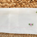 lenzuolo sopra neonata ricamato con fiori rosa