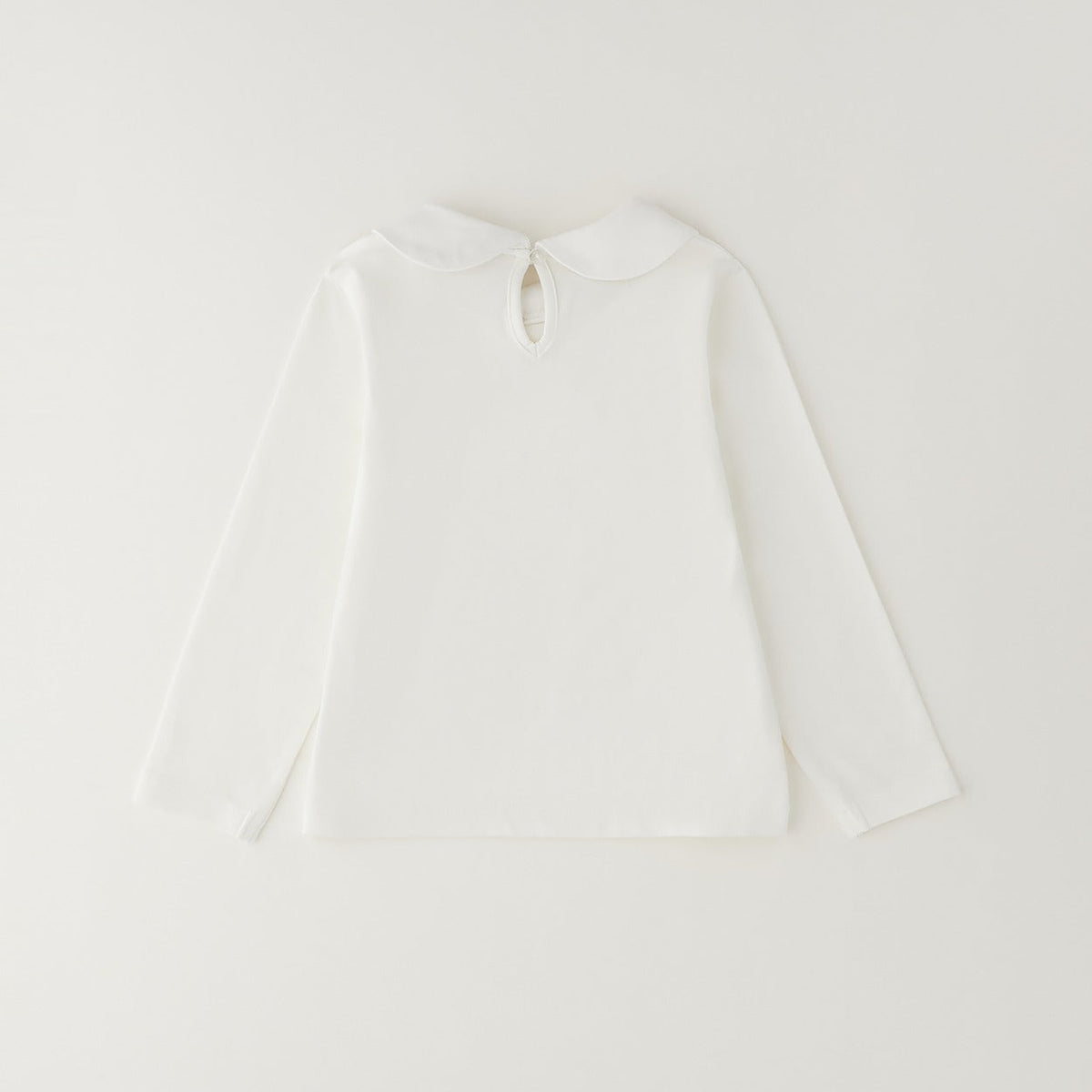 	Maglia bambina bianca Sarabanda in cotone con colletto arrotondato e maniche lunghe