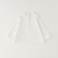 Giacca bimba in caldo cotone color panna con balza e chiusura frontale